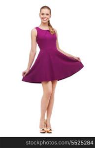 beauty, fashion and happy people concept - young woman in purple dress and high heels