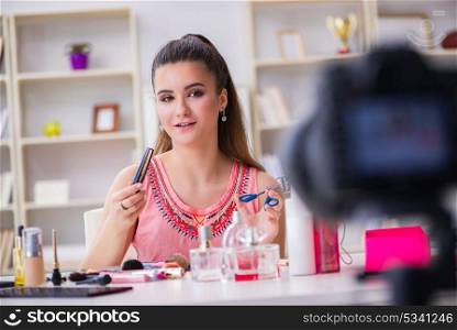 Beauty fashion blogger recording video for blog