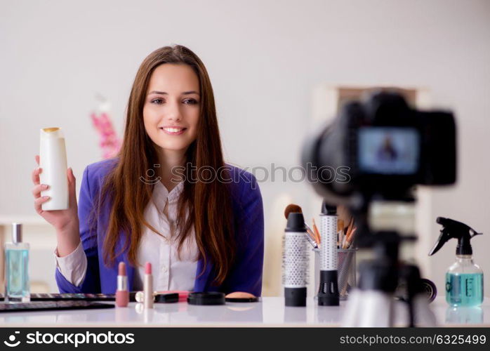 Beauty fashion blogger recording video for blog