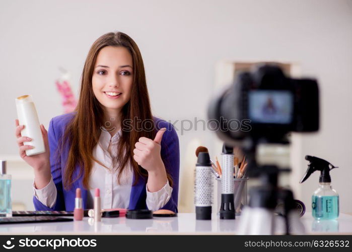 Beauty fashion blogger recording video for blog