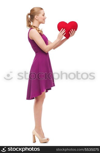 beauty, fashion, love and happy people concept - young woman in purple dress and high heels and red heart