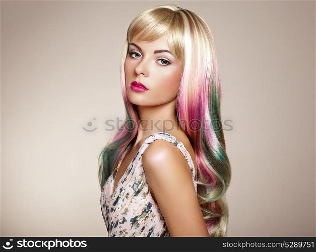 Beauty fashion model girl with colorful dyed hair. Girl with perfect makeup and hairstyle. Model with perfect healthy dyed hair