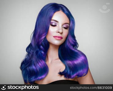 Beauty Fashion Model Girl with Colorful Dyed Hair. Girl with perfect Makeup and Hairstyle. Model with perfect Healthy Dyed Hair. Blue Hair