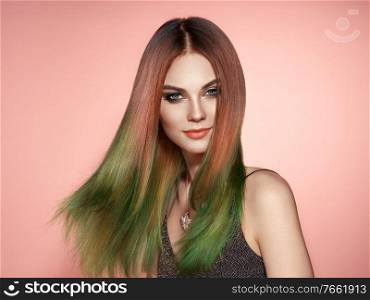 Beauty fashion model girl with colorful dyed hair. Girl with perfect makeup and hairstyle. Model with perfect healthy smooth hair
