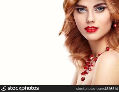 Beauty fashion model redhead girl portrait. Sexy young woman with perfect makeup and trendy red accessories. Smiling cheerful girl in open white background. Fashion glamour female