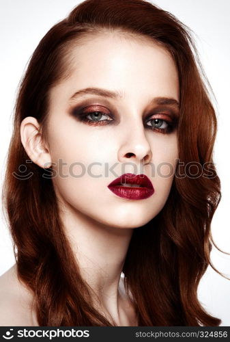 Beauty fashion model with ginger hair and red lips makeup on white background