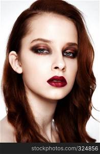Beauty fashion model with ginger hair and red lips makeup on white background