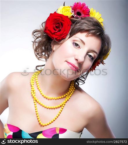 Beauty female face - happy young fashionable girl with flowers. series of photos