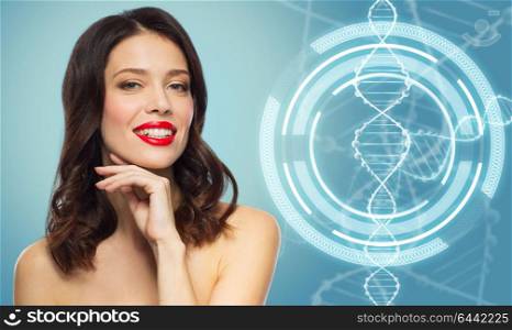 beauty, genetics and people concept - happy smiling young woman with red lipstick posing over blue background and dna molecule hologram. woman with red lipstick over dna molecule