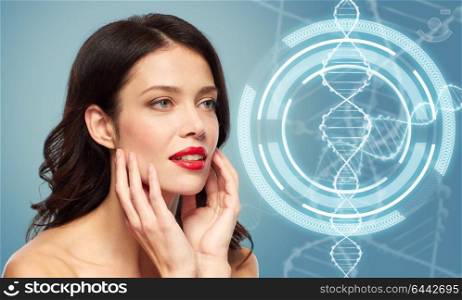 beauty, genetics and people concept - happy smiling young woman with red lipstick over blue background and dna molecule hologram. woman with red lipstick over dna molecule