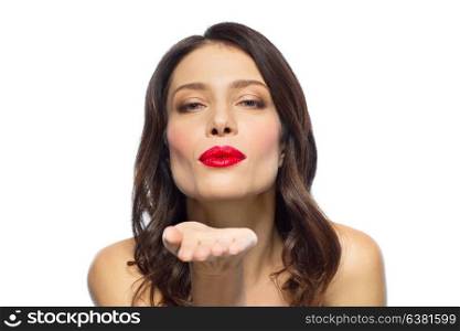 beauty, gesture and valentines day concept - beautiful woman with red lipstick blowing air kisses. beautiful woman with red lipstick blowing air kiss