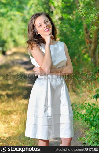 beauty girl in a fashioned dress in a forest