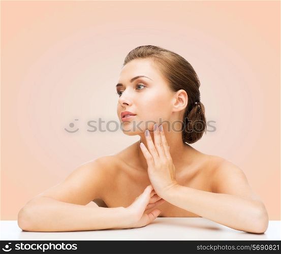 beauty, health and people concept - smiling beautiful woman with clean perfect skin over beige background