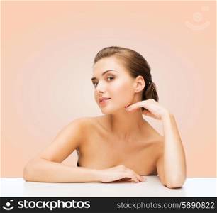 beauty, health and people concept - smiling beautiful woman with clean perfect skin over beige background