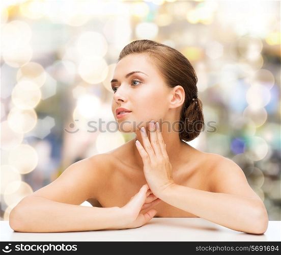 beauty, health and people concept - smiling beautiful woman with clean perfect skin over lights background