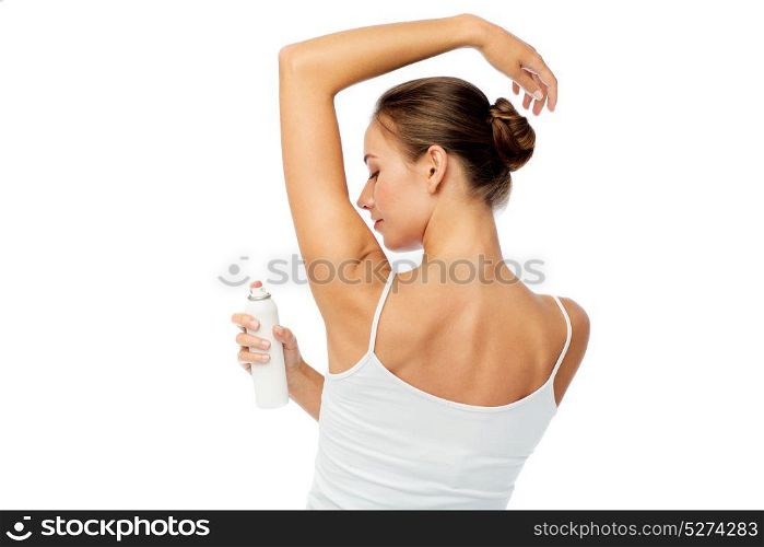 beauty, hygiene, bodycare and people concept - beautiful young woman applying antiperspirant or spray deodorant over white background. woman with antiperspirant deodorant over white