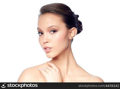 beauty, jewelry, accessories, people and luxury concept - face of beautiful young asian woman with golden ring
