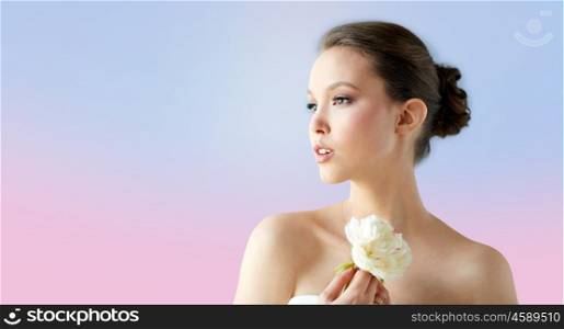 beauty, jewelry, people and luxury concept - beautiful asian woman or bride in white dress with peony flower and golden ring over rose quartz and serenity gradient background
