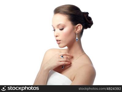 beauty, jewelry, people and luxury concept - beautiful asian woman or bride with earring, finger ring and pendant
