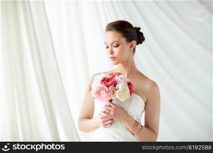 beauty, jewelry, people and luxury concept - beautiful asian woman or bride in white dress with peony flower, golden ring and bracelet