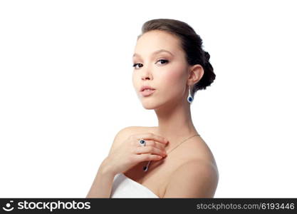 beauty, jewelry, people and luxury concept - beautiful asian woman or bride with earring, finger ring and pendant