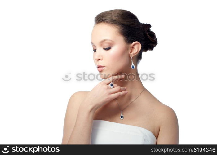 beauty, jewelry, people and luxury concept - beautiful asian woman or bride with earring, finger ring and pendant