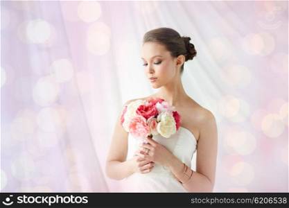 beauty, jewelry, people and luxury concept - beautiful asian woman or bride in white dress with peony flower, golden ring and bracelet over holidays lights background