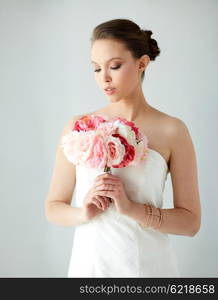 beauty, jewelry, people and luxury concept - beautiful asian woman or bride in white dress with peony flower, golden ring and bracelet