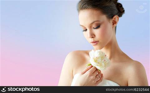 beauty, jewelry, people and luxury concept - beautiful asian woman or bride in white dress with peony flower and golden ring over rose quartz and serenity gradient background