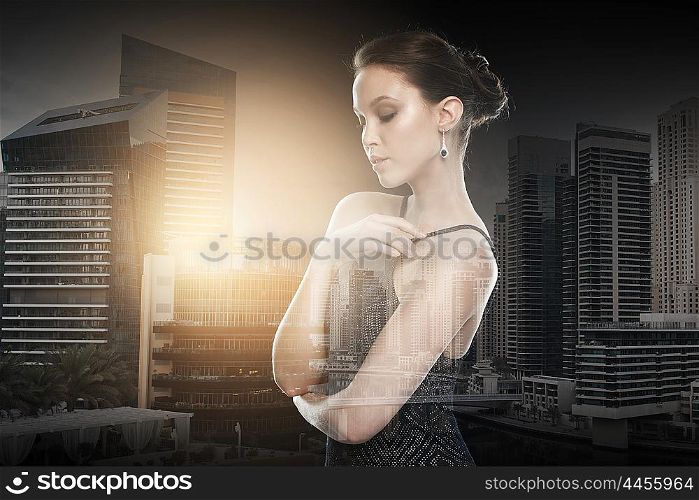 beauty, jewelry, wedding accessories, people and luxury concept - beautiful asian woman with diamond earring over dubai city with double exposure background