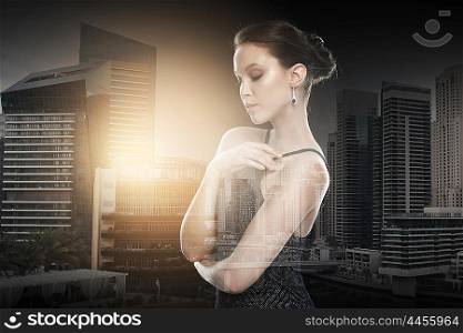 beauty, jewelry, wedding accessories, people and luxury concept - beautiful asian woman with diamond earring over dubai city with double exposure background
