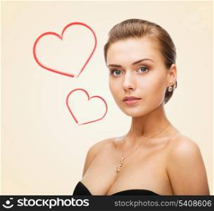beauty, love and jewelry concept - charming woman wearing shiny diamond earrings
