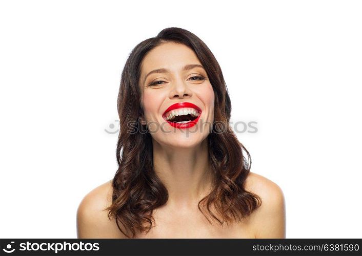 beauty, make up and people concept - happy laughing young woman with red lipstick over white background. beautiful laughing young woman with red lipstick