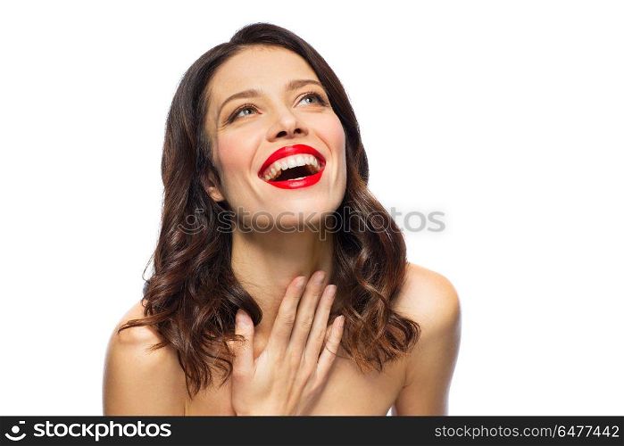 beauty, make up and people concept - happy laughing young woman with red lipstick over white background. beautiful laughing young woman with red lipstick. beautiful laughing young woman with red lipstick