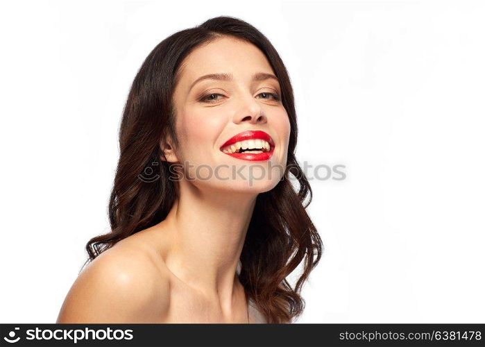 beauty, make up and people concept - happy smiling young woman with red lipstick over white background. beautiful smiling young woman with red lipstick