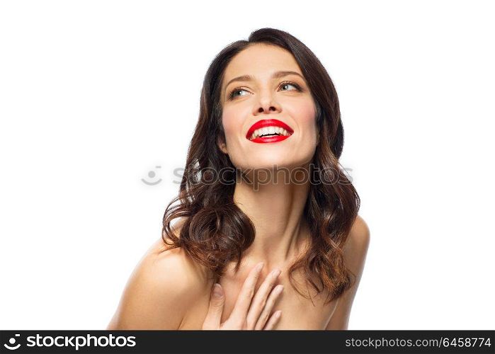 beauty, make up and people concept - happy smiling young woman with red lipstick posing over white background. beautiful smiling young woman with red lipstick