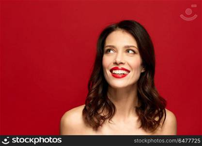 beauty, make up and people concept - happy smiling young woman with red lipstick. beautiful smiling young woman with red lipstick. beautiful smiling young woman with red lipstick