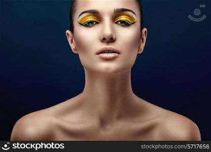 beauty, make-up yellow, on a blue background