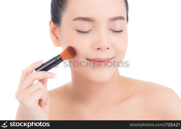 Beauty of portrait asian woman applying make up with brush of cheek isolated on white background, beautiful of girl holding blusher, skincare and cosmetic concept.