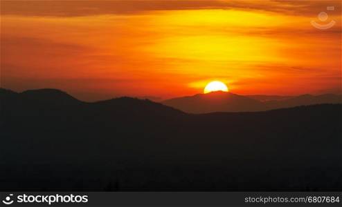Beauty of the sun during the time sunset over the mountain range