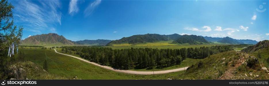 Beauty panoramic picture. Beauty panoramic picture of summer Altai. Green and yellow meadow with trees on mountain background