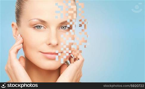 beauty, people and body care concept - beautiful young woman touching her face over blue background