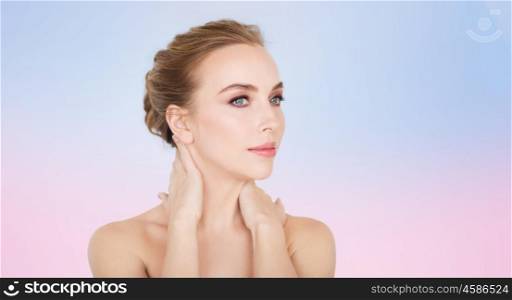 beauty, people and bodycare concept -beautiful young woman face and hands over rose quartz and serenity gradient background
