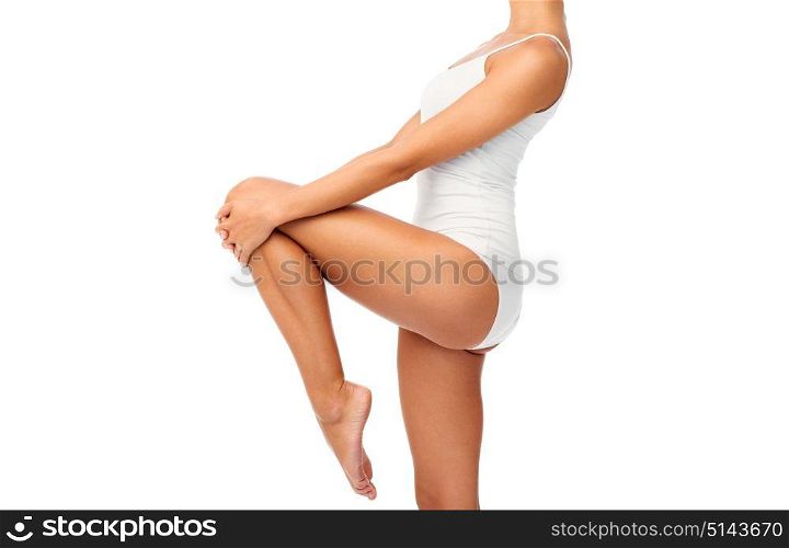 beauty, people and bodycare concept - close up of beautiful young woman in white underwear. close up of young woman body in white underwear