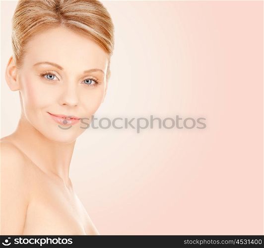 beauty, people and health concept - beautiful young woman face over beige background