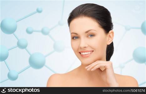 beauty, people and health concept - beautiful young woman face over blue background with molecules. face and hands of beautiful woman