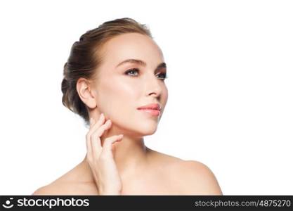 beauty, people and health concept - beautiful young woman touching her face and neck over white background