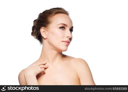 beauty, people and health concept - beautiful young woman touching her neck over white background
