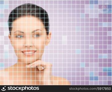 beauty, people and health concept - beautiful young woman with bare shoulders touching her face over violet background with squared grid