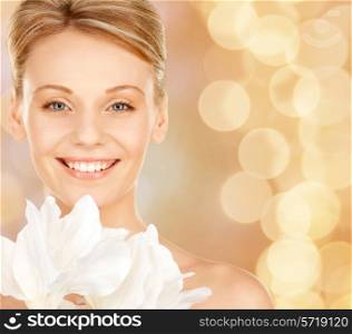 beauty, people and health concept - beautiful young woman with bare shoulders over beige lights background